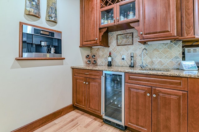 34 Clark Ln, Harriman, NY 10926 - indoor dry bar with wine cooler, baseboards, light wood-style flooring, and decorative backsplash