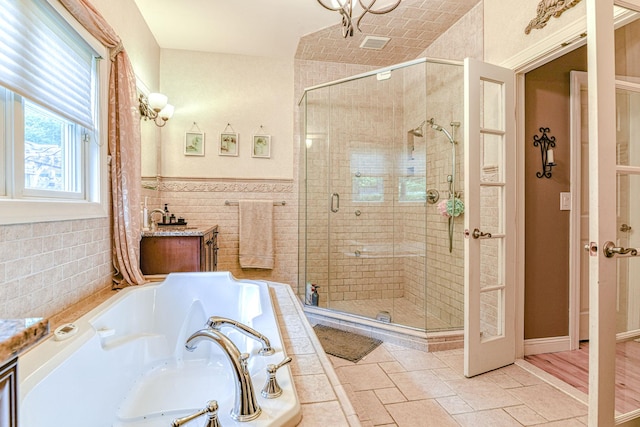 34 Clark Ln, Harriman, NY 10926 - full bath featuring a garden tub, a stall shower, vanity, and tile walls