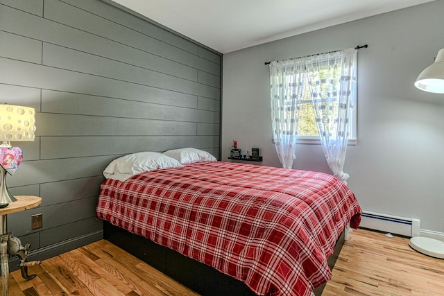 34 Clark Ln, Harriman, NY 10926 - bedroom featuring a baseboard radiator, wood finished floors, and wooden walls