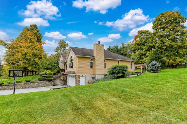 34 Clark Ln, Harriman, NY 10926 - view of property exterior with a garage, a chimney, asphalt driveway, and a yard