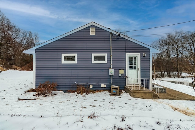 view of snow covered house