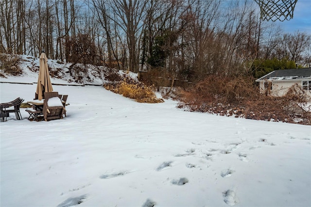 view of yard layered in snow