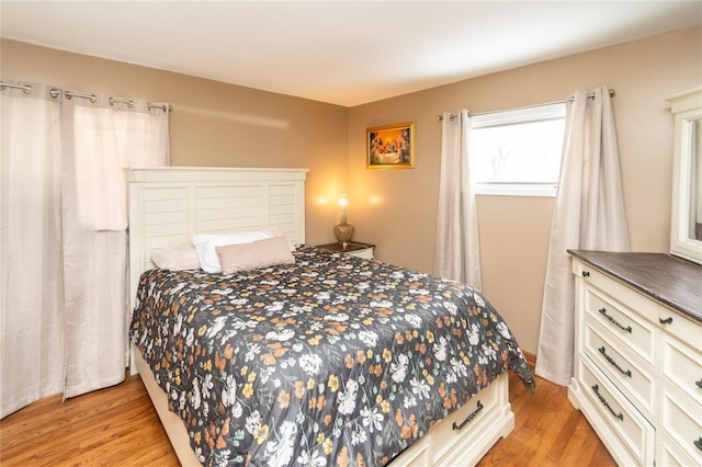 bedroom with light wood-style floors