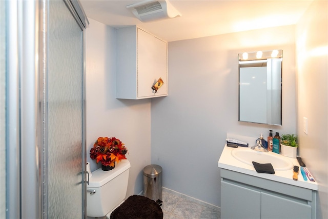 bathroom featuring toilet, baseboards, visible vents, and vanity