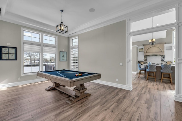 rec room featuring baseboards, ornamental molding, billiards, and light wood-style floors