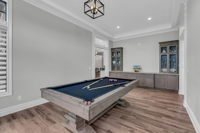 playroom featuring baseboards, ornamental molding, wood finished floors, and pool table