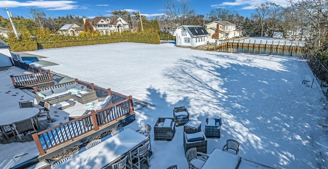 snowy aerial view with a residential view