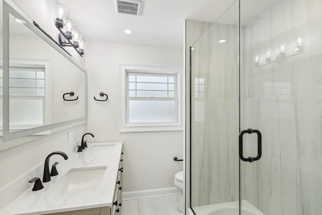 full bathroom featuring visible vents, a sink, toilet, and an enclosed shower