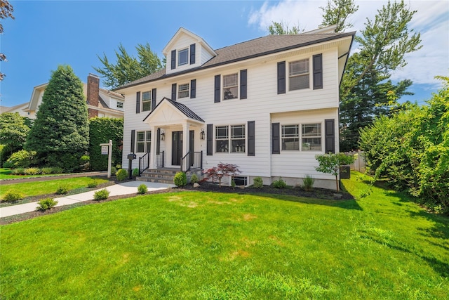 12 Shepherd St, Rockville Centre, NY 11570 - view of front facade with a front lawn