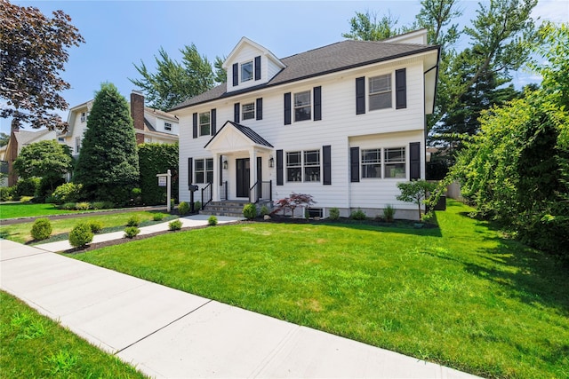 12 Shepherd St, Rockville Centre, NY 11570 - colonial home featuring a front yard