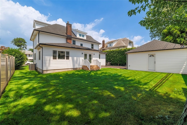 12 Shepherd St, Rockville Centre, NY 11570 - back of house with french doors, a chimney, and a shingled roof