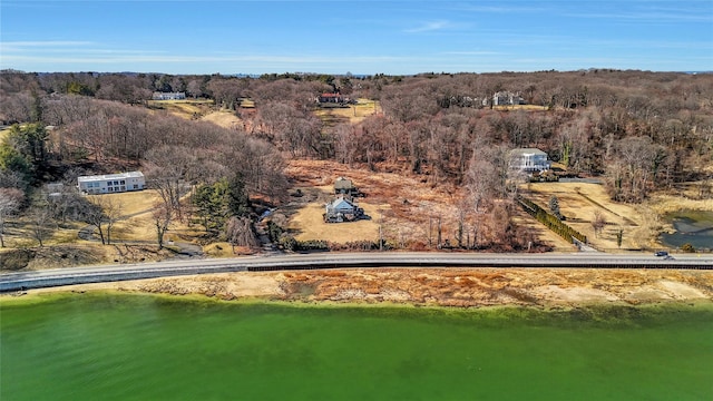 bird's eye view featuring a wooded view