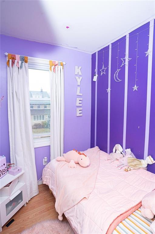 bedroom with wood finished floors