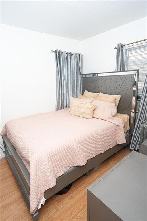 bedroom with light wood-style floors