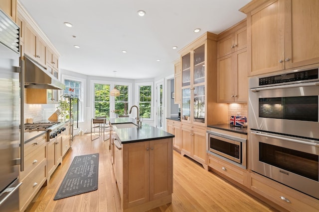 9 Owls Nest Ln, East Hampton, NY 11937 - kitchen featuring built in appliances, a sink, under cabinet range hood, light brown cabinets, and recessed lighting