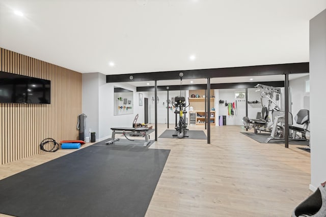 9 Owls Nest Ln, East Hampton, NY 11937 - workout area with wood finished floors, an accent wall, and recessed lighting
