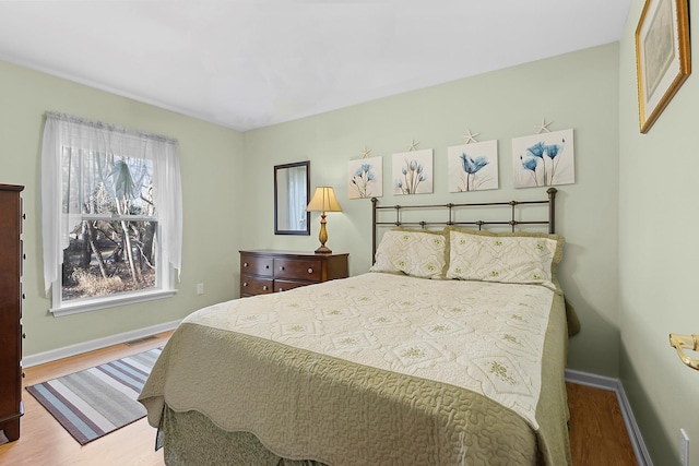 bedroom with light wood-type flooring