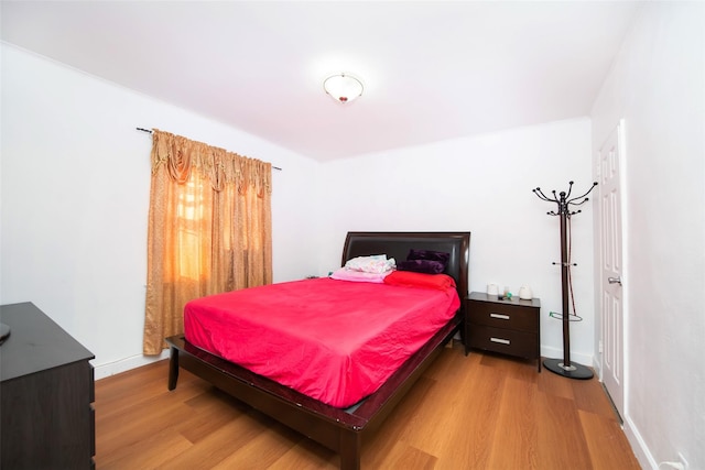 bedroom with light wood-type flooring