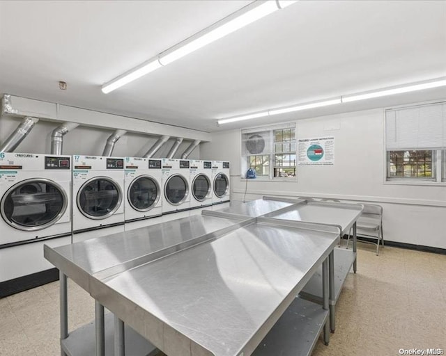 laundry room featuring washing machine and clothes dryer