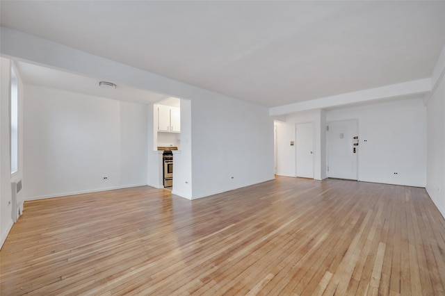 unfurnished living room featuring light hardwood / wood-style flooring