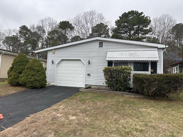 view of home's exterior with driveway and an attached garage