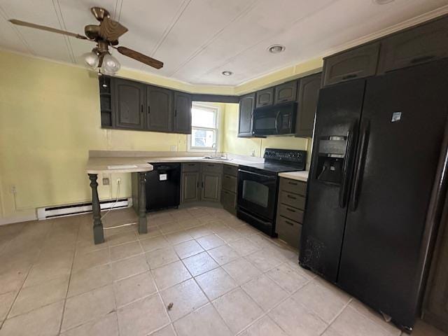 kitchen featuring a baseboard radiator, ceiling fan, a sink, black appliances, and light countertops