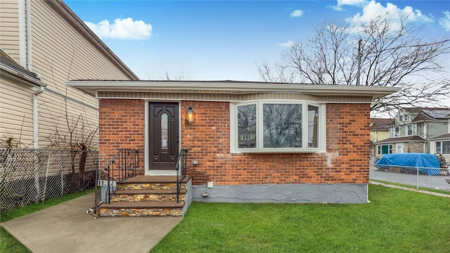 entrance to property with a yard