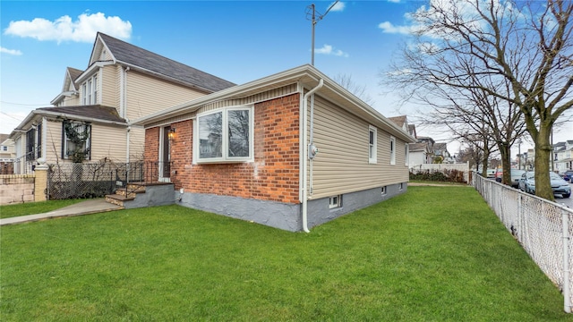 view of home's exterior featuring a yard