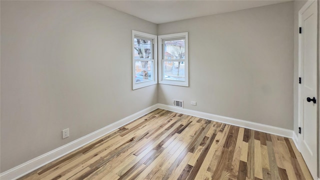 empty room featuring light hardwood / wood-style floors