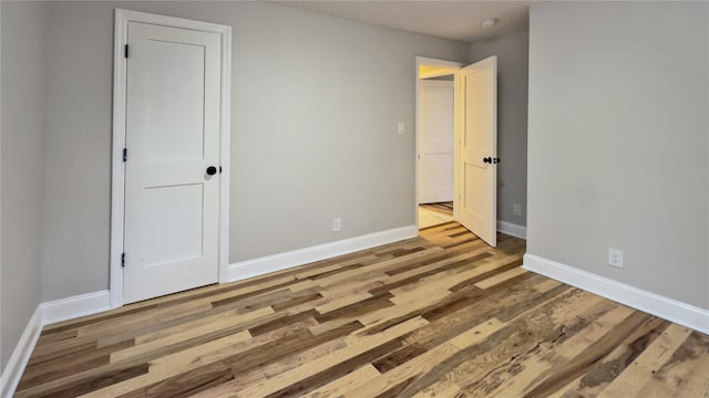 spare room featuring hardwood / wood-style flooring