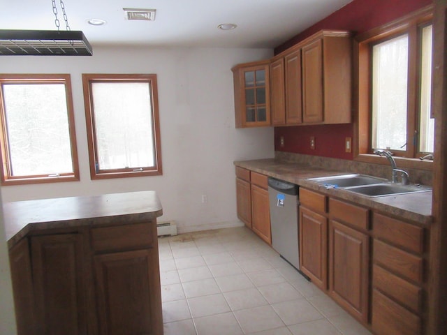 kitchen with sink, light tile patterned floors, a baseboard radiator, and dishwasher