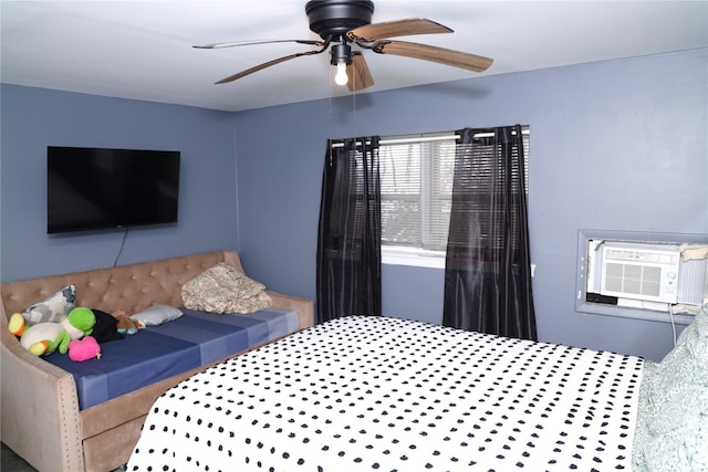 bedroom featuring cooling unit and ceiling fan