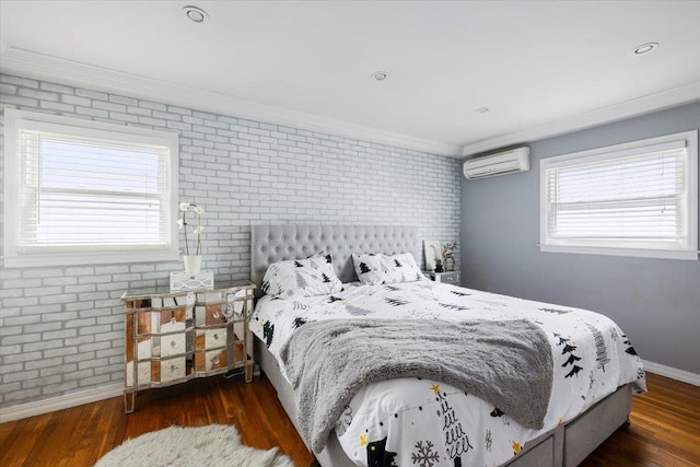 bedroom featuring crown molding, dark hardwood / wood-style floors, a wall mounted AC, and brick wall