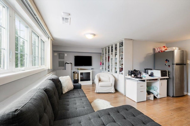 living room with light hardwood / wood-style flooring