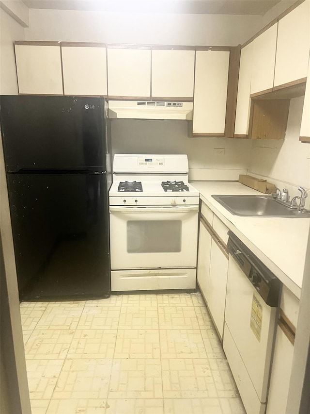 kitchen with white cabinetry, sink, and white appliances