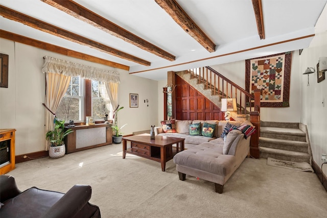 living room with light colored carpet and beam ceiling