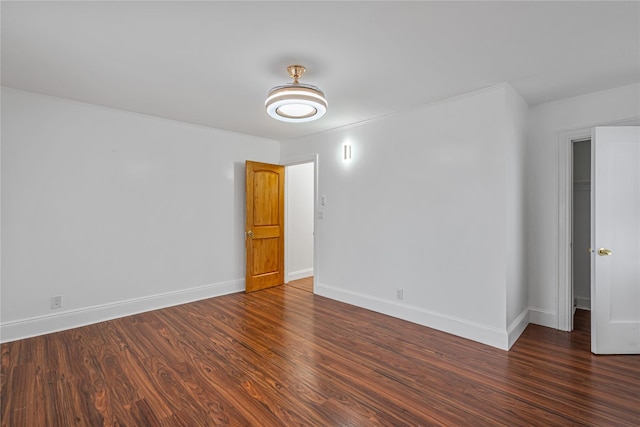 spare room featuring dark hardwood / wood-style floors