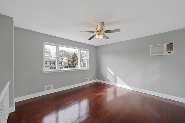 15 Bart Dr, Selden, NY 11784 - unfurnished room with visible vents, an AC wall unit, ceiling fan, wood finished floors, and baseboards
