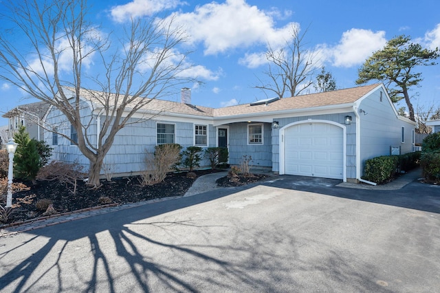 ranch-style house featuring a garage