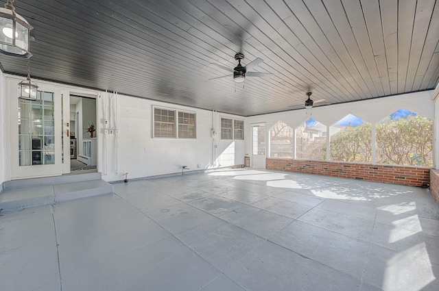 unfurnished sunroom with wood ceiling