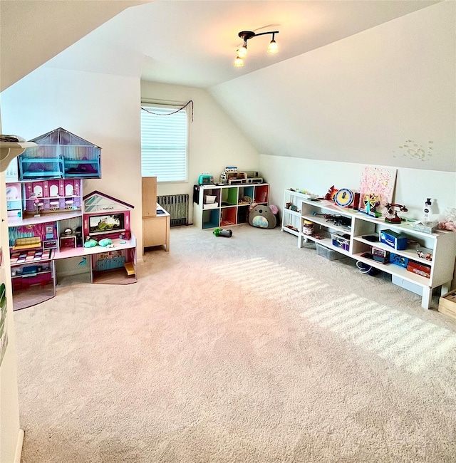 playroom featuring lofted ceiling and carpet