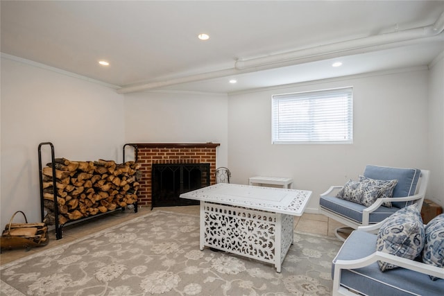 sitting room with ornamental molding, a brick fireplace, and light tile patterned floors