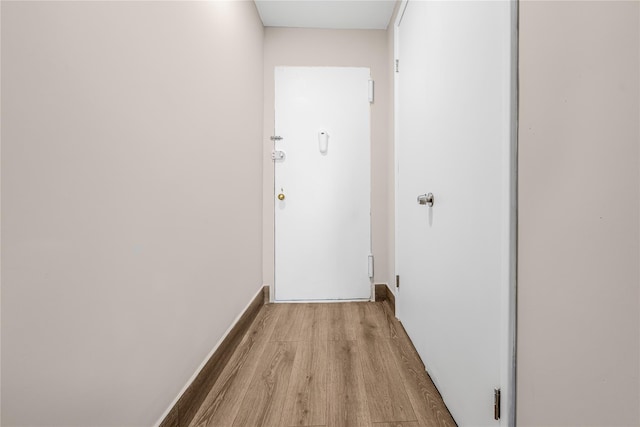 corridor with wood finished floors