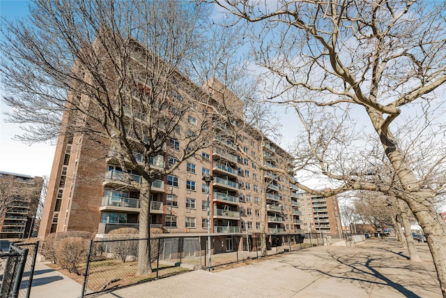 view of building exterior featuring fence