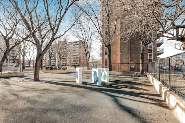 view of home's community with fence