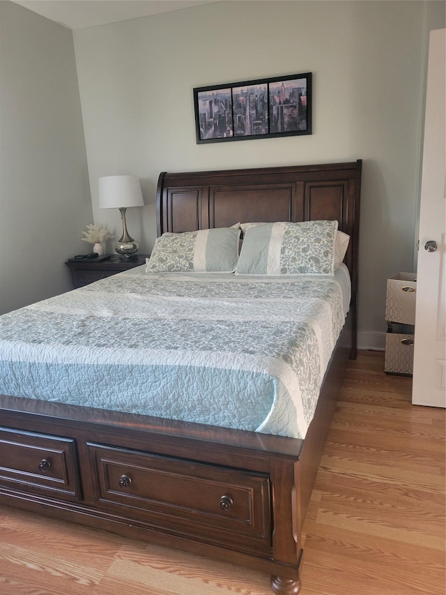 bedroom with light hardwood / wood-style floors