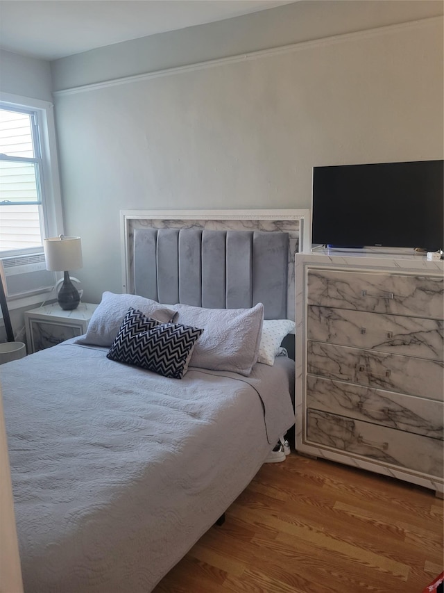 bedroom featuring wood-type flooring