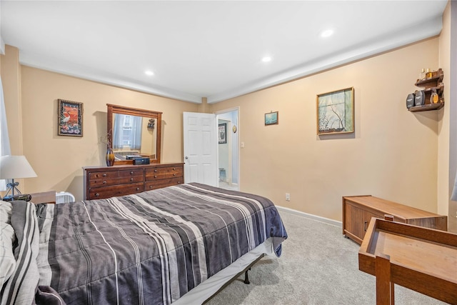 bedroom featuring light carpet