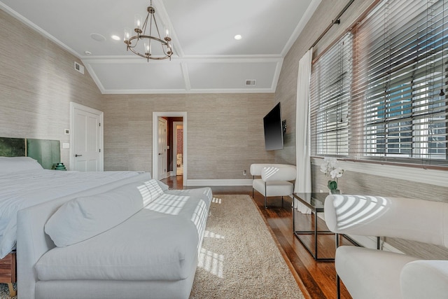 bedroom featuring wood finished floors, visible vents, and wallpapered walls