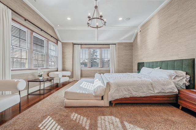 bedroom with lofted ceiling, wood finished floors, wallpapered walls, an inviting chandelier, and crown molding